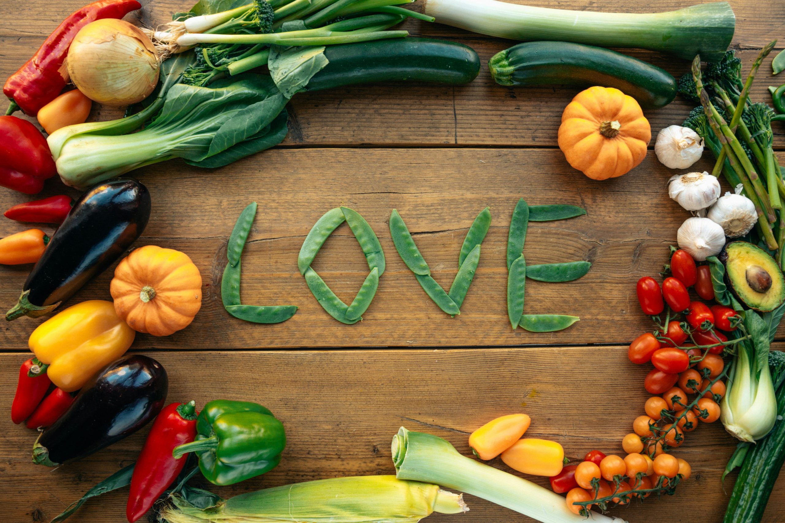 vegetables and fruits artfully arranged on a table