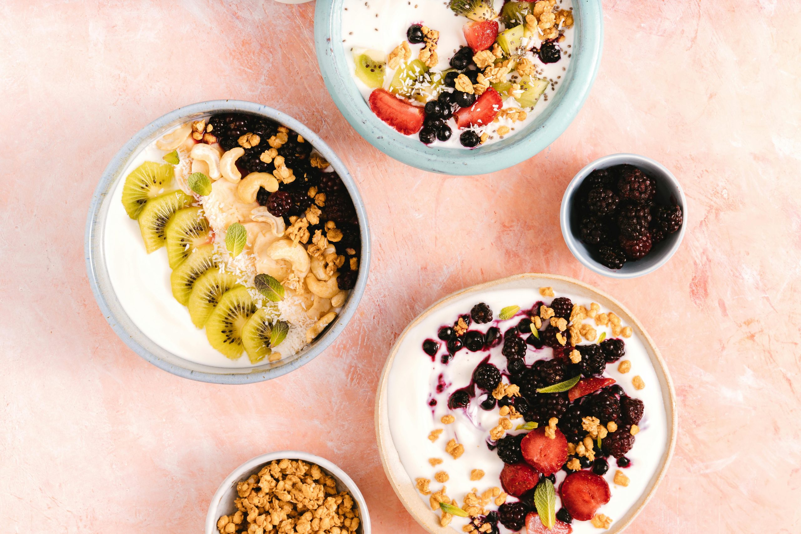 Bowls of probiotic-rich yogurt with various toppings